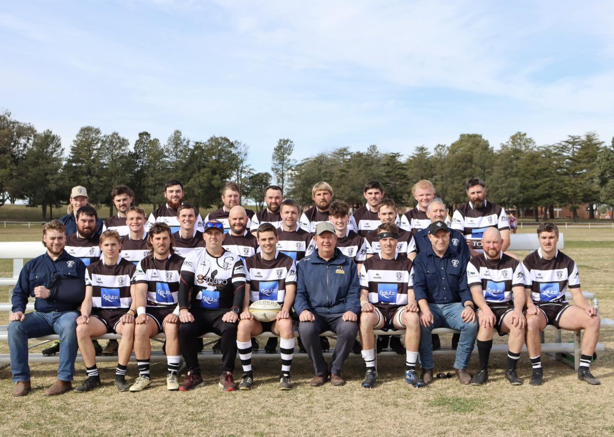 Yass Rams Rugby Union Club members sitting in three rows.