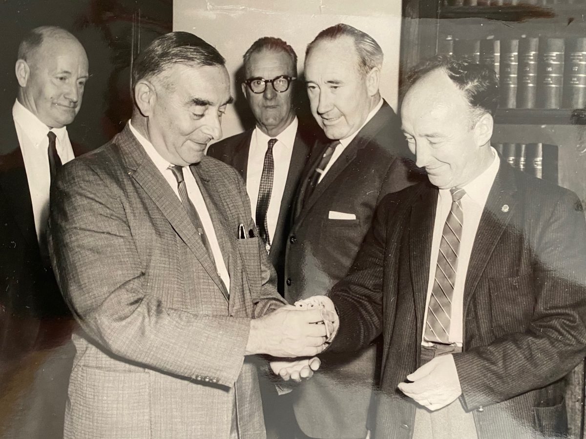 NSW Minister for Housing and Housing Cooperative Societies Abram Landa (left) receives a bunch of keys from Goulburn builder Tom Skeffington in 1963, while the then mayor of Goulburn Ernie McDermott (centre) and two other men witness the exchange. This was a peak period for Tom’s building enterprise.