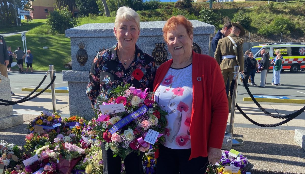 Quota Club Narooma members Carol Mead and Wendy Mancell present a wreath on Anzac Day.