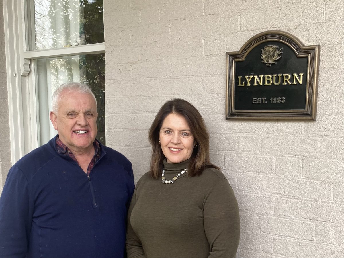 Greg and Marguerite Evans on Lynburn’s front verandah. They have researched, restored and repainted inside and out of their historic home in Goulburn. 