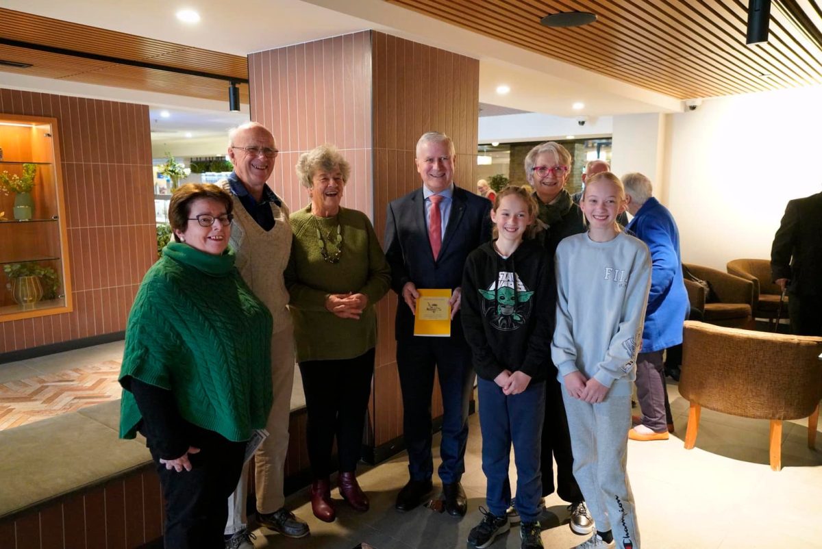 Member for Riverina Michael McCormack with (from left) Lambing Flat Fellowship of Australian Writers Young Branch president Jennifer Haynes, John Dwyer, Joan Dwyer, Chelsea Dwyer (11), Hilltops Council Mayor Margaret Roles and Charlie Dwyer (13).