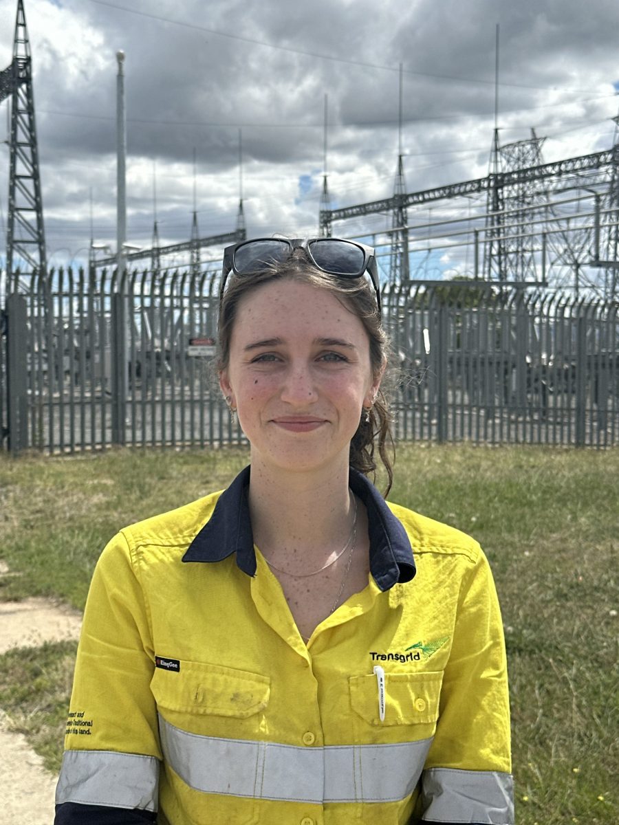 Woman in yellow fluro with glasses on her head