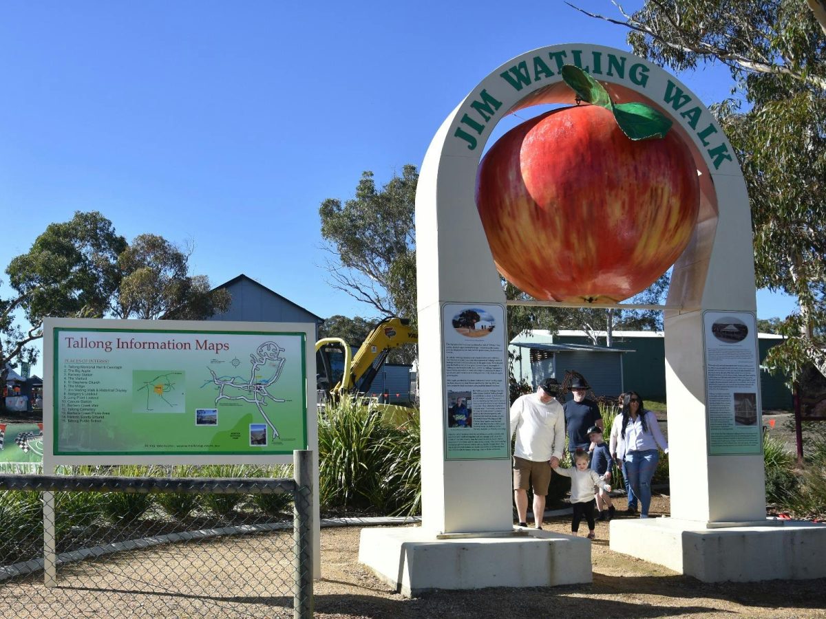 An apple statue and an information board