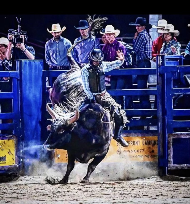 Man on bucking bull