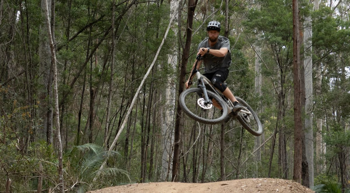 Mountain biker takes a jump.