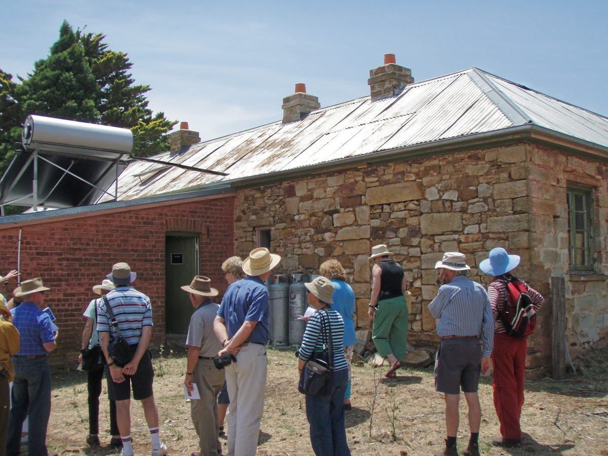 people inspecting an old house