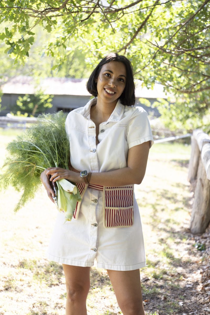 Woman carrying bunch of vegetables