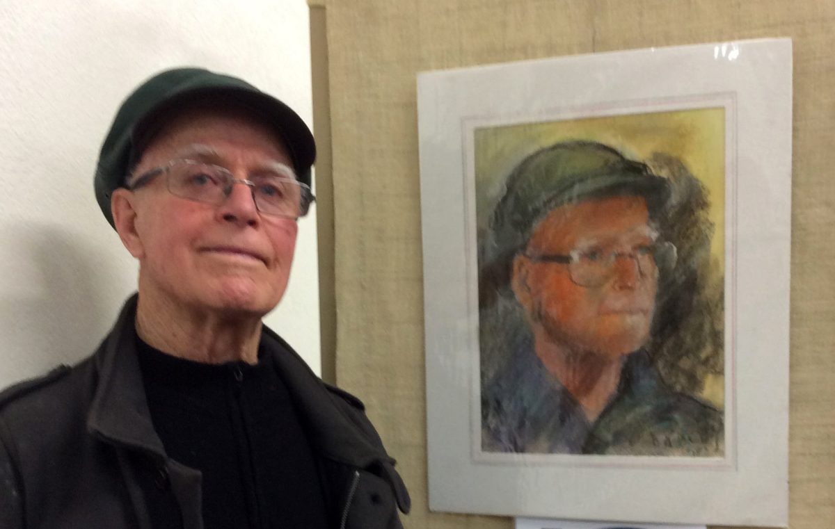 Brian Passmore with his portrait after a local artist requested him to sit. 