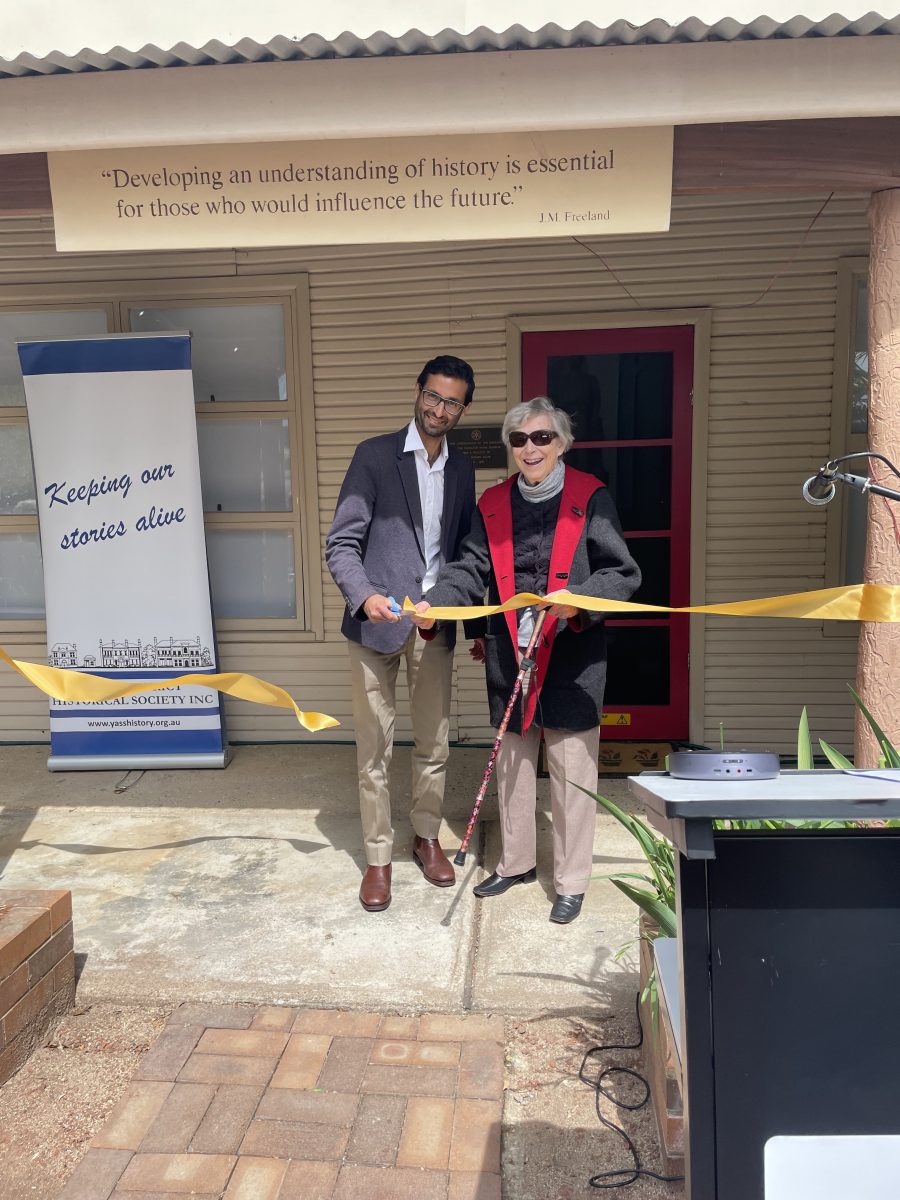 Man and woman cut ribbon at venue's official opening ceremony