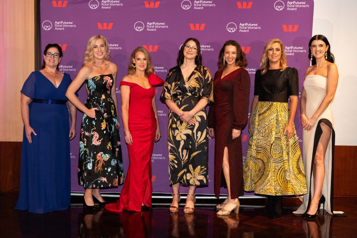 Five women in shiny frocks