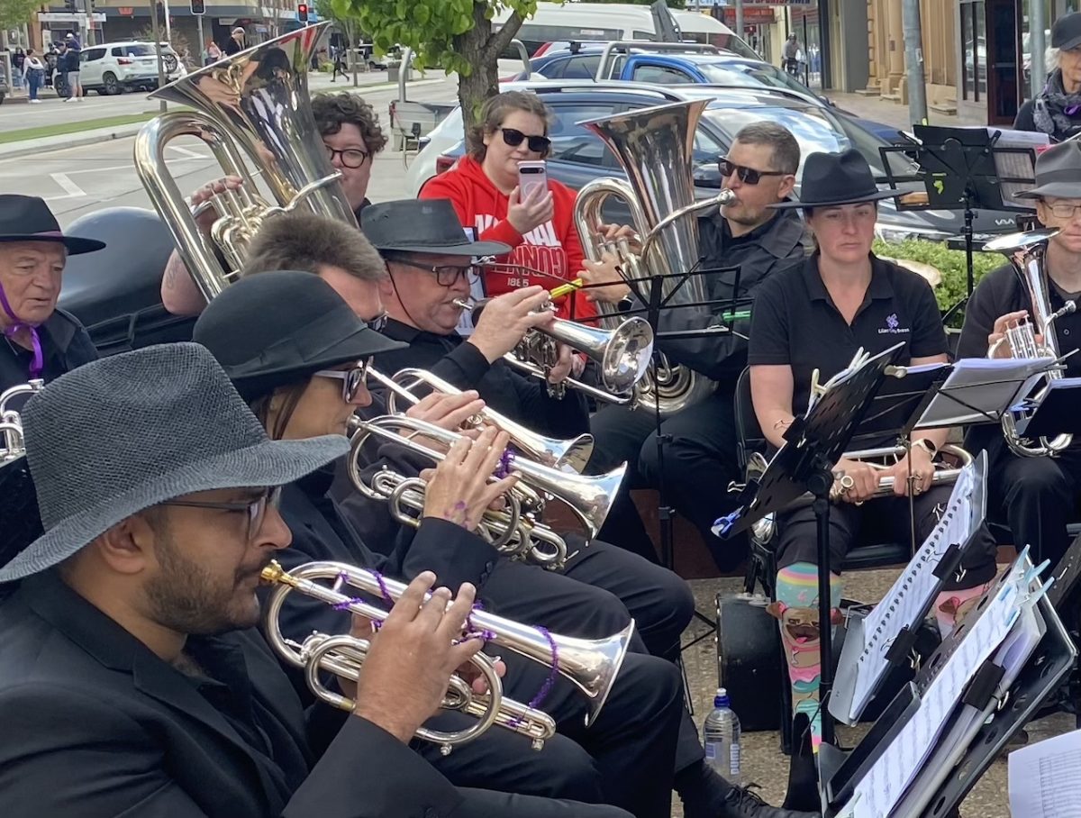 brass band performing in town street