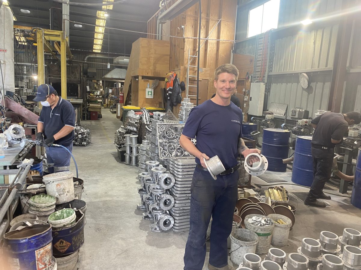 Troy Rath with some of the metal products made at Camcast Foundry in Goulburn. The niche manufacturer has made everything from fuel hose couplings and electrical components to V8 car manifolds and an engine head for an early Triumph motorcycle. 