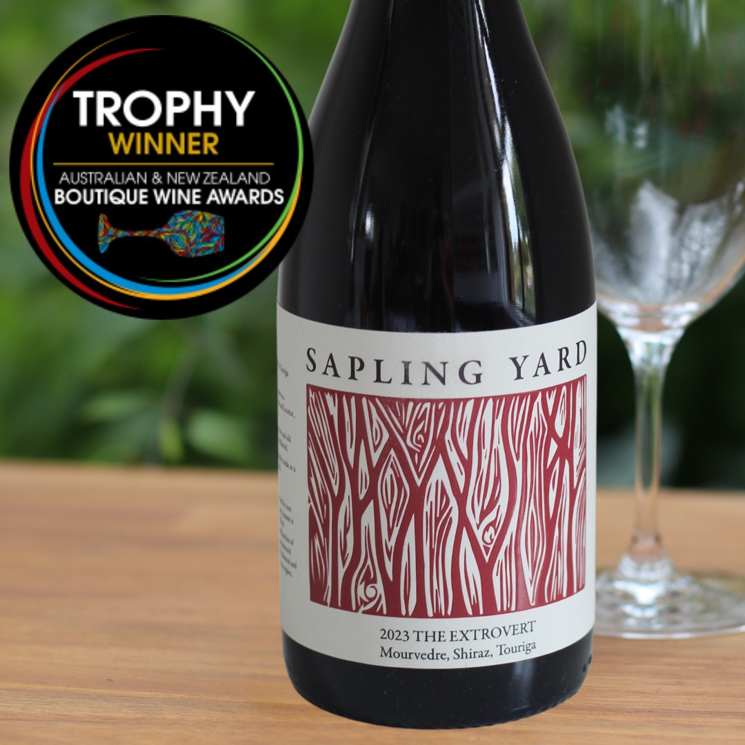 An image of a wine label reading Sapling Yard, The Extrovert and an overlaid graphic reading Trophy Winner, Australian and New Zealand Boutique Wine Awards.