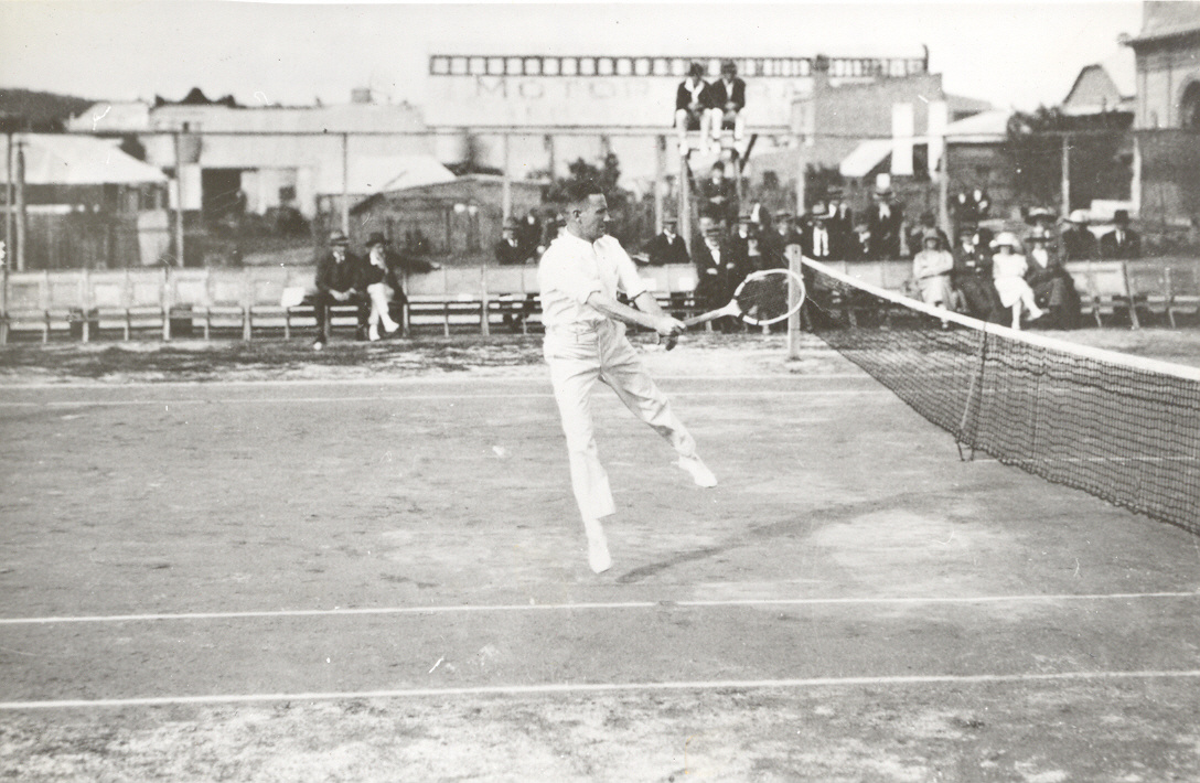 Unknown person playing at the Bega Tennis Club in the early 1920s.