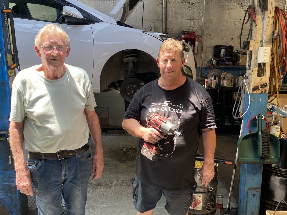 Bill Martin with his son Christopher in their workshop. Out the front of their workshop stand the family’s numerous racing trophies from Goulburn, Sydney, Tralee near Canberra and Oran Park. Bill has a network of specialists like himself to help build high-performance engines.