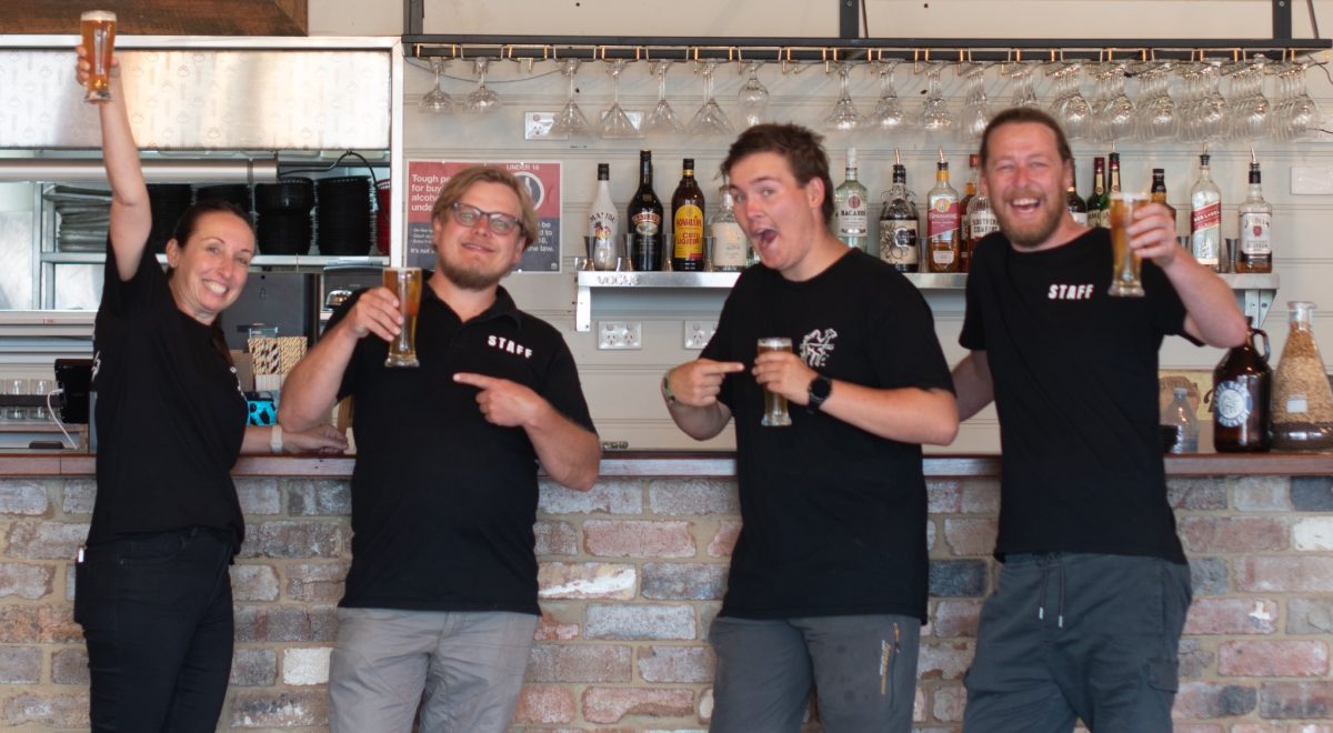 four people with glasses of beer