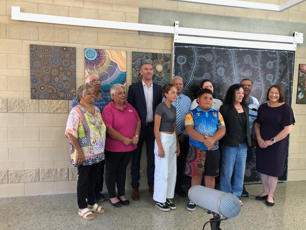 A group of people at a building's opening ceremony