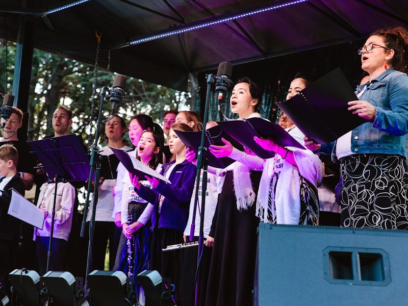 Photo of carollers on stage at the Queanbeyan Palerang community Christmas event 