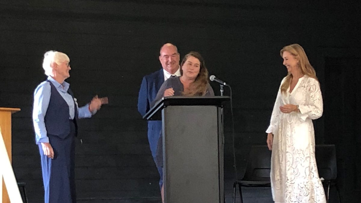 Kathryn Doolin accepts the Cobargo Citizen of 2025 award on behalf of her mother, with CWA Cobargo Branch president Lynn Lawson, Bega Valley Shire Mayor Russell Fitzpatrick, and TV presenter Catriona Rowntree.