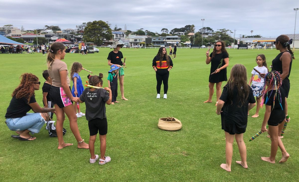 Children doing a song and dance workshop with Marra-Wanggan Cultural Services at the edge of Survival Day in Bermagui on 26 January.