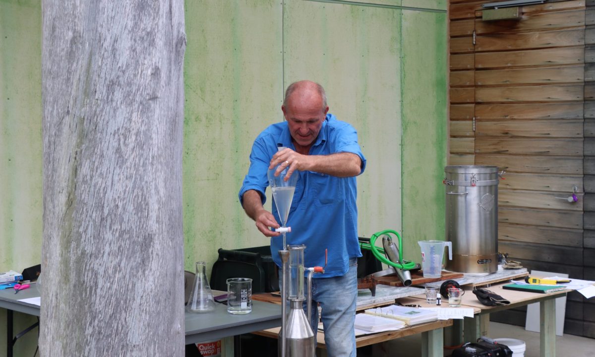 man conducting a distilling workshop 