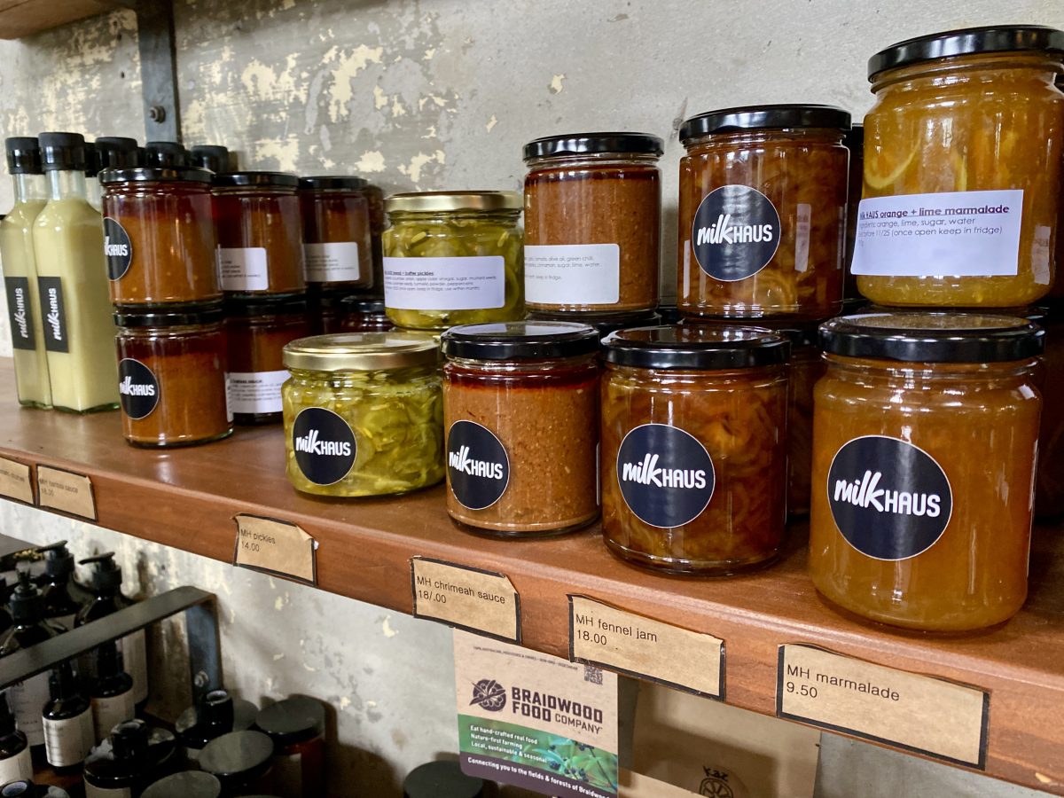 Jars of milkHAUS branded preserves on a shelf