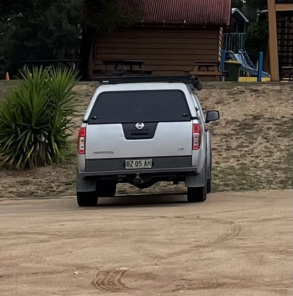 A white car photographed from the back