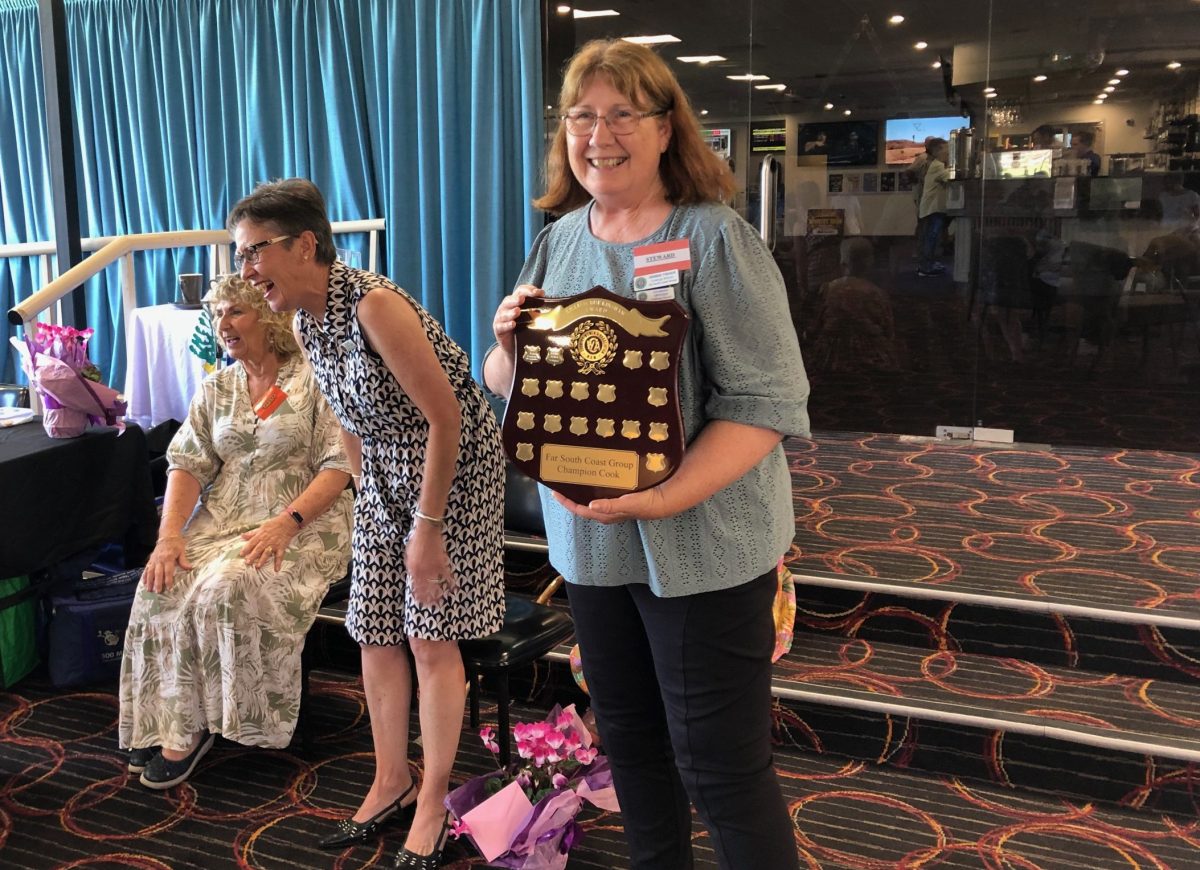 CWA Cobargo member Debbie Fisher who won the Best Exhibit in Show in the cooking competition for the second consecutive year, with judges Nelleke Gorton and Ellice Shrader. 