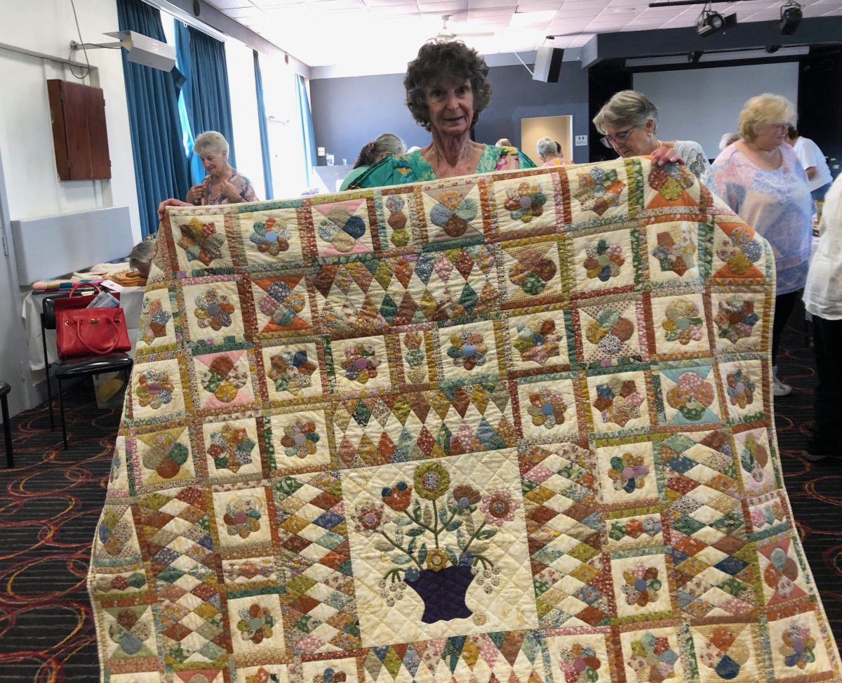 Marjory O'Brien of CWA Bermagui branch with the quilt in the London House pattern that won the over-80s handicraft competition.