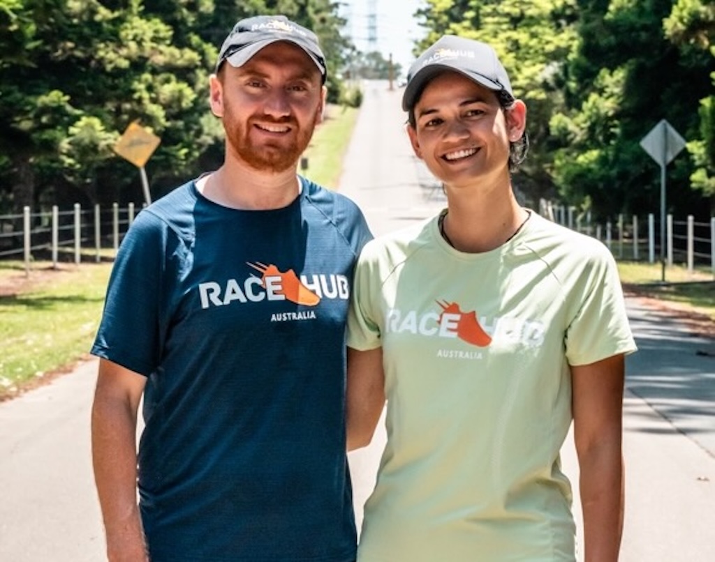 smiling man and woman standing on a road