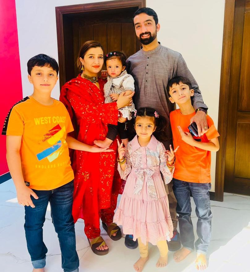 Mushfiq with his wife and four children in Pakistan in 2024.