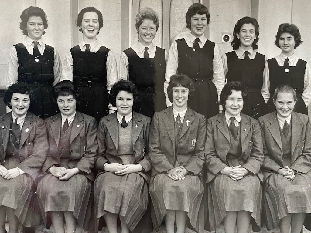 Our Lady of Mercy College high school pupils in 1960. The borders in their jackets are seated, while the day students are standing. Verna Taylor is back row third on the right with a cheeky smile. She says the day students ignored a rule forbidding them to mix with the borders. Instead, they became firm friends.