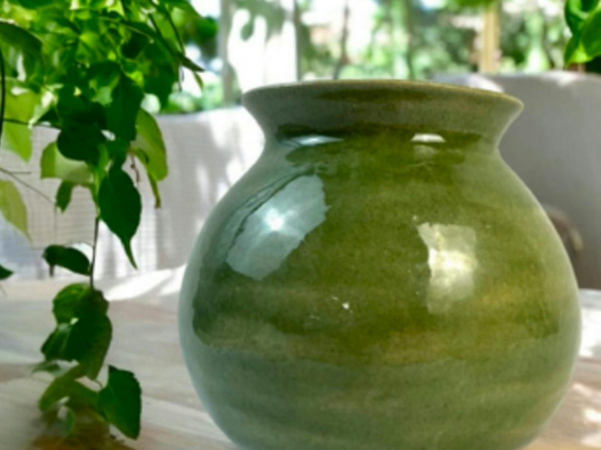 photo of a green clay vase 