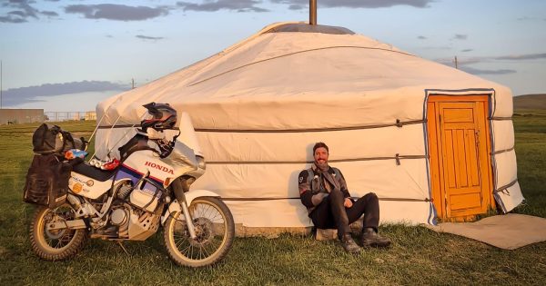 Adventurer returns home after 30,000km bike ride across Russia, Eastern Europe and Silk Road