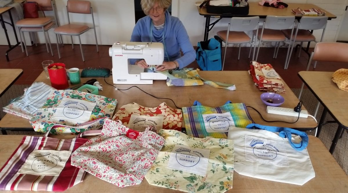 Volunteer Heather West making Boomerang Bags several years ago when Goulburn joined a world-wide campaign to introduce the recyclable bag as an alternative to plastic bags.