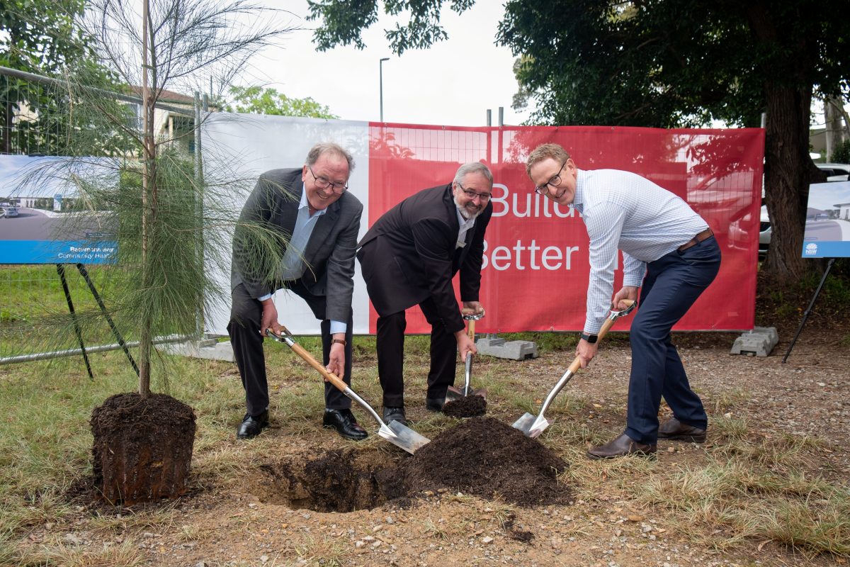 three men doing the honours at a sod-turning ceremony