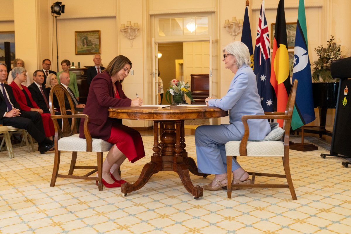 Two women sitting down at a table