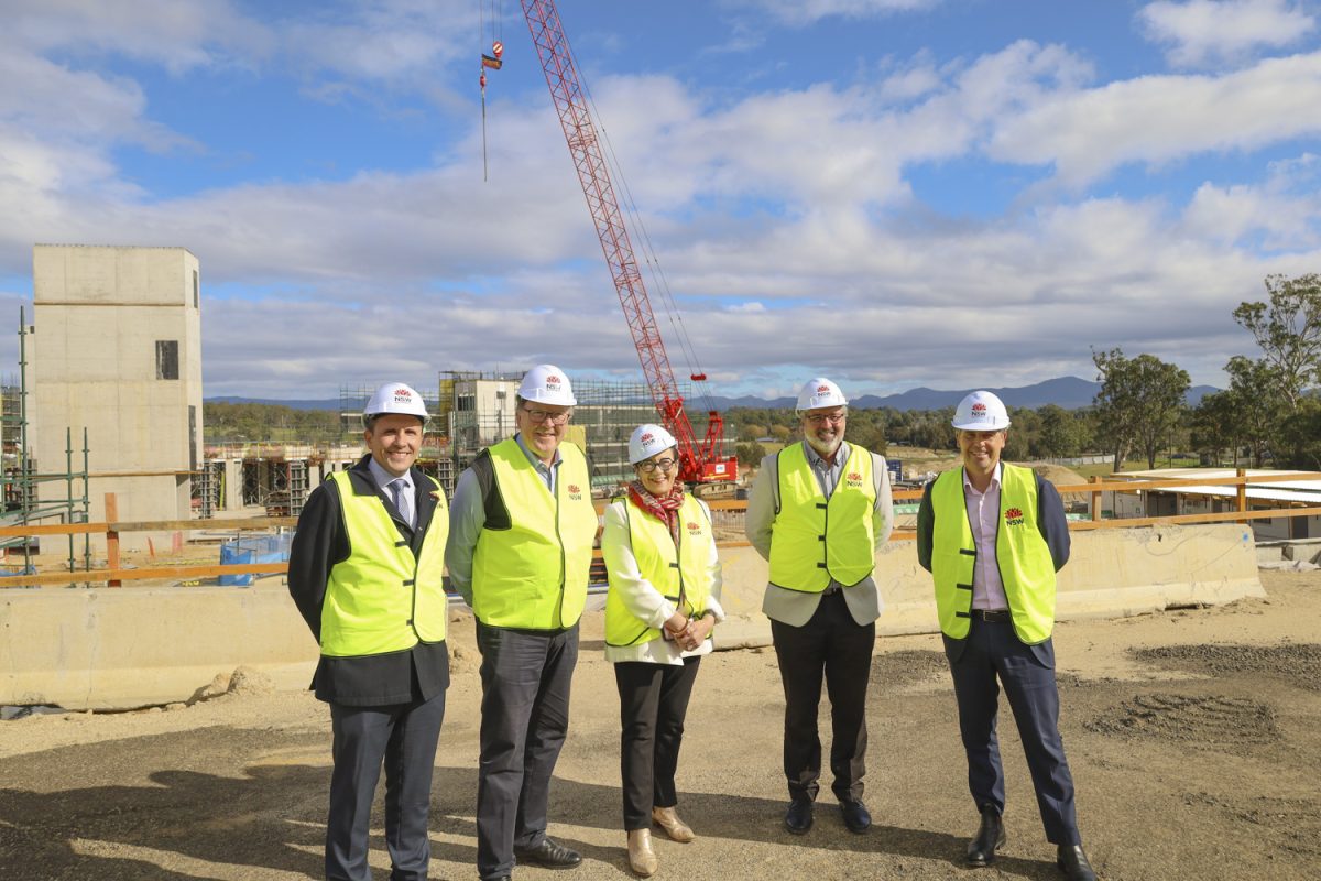 Regional Health Minister Ryan Park (left) with Member for Bega Dr Michael Holland and staff from Southern NSW Local Health District at the Eurobodalla Regional Hospital site.