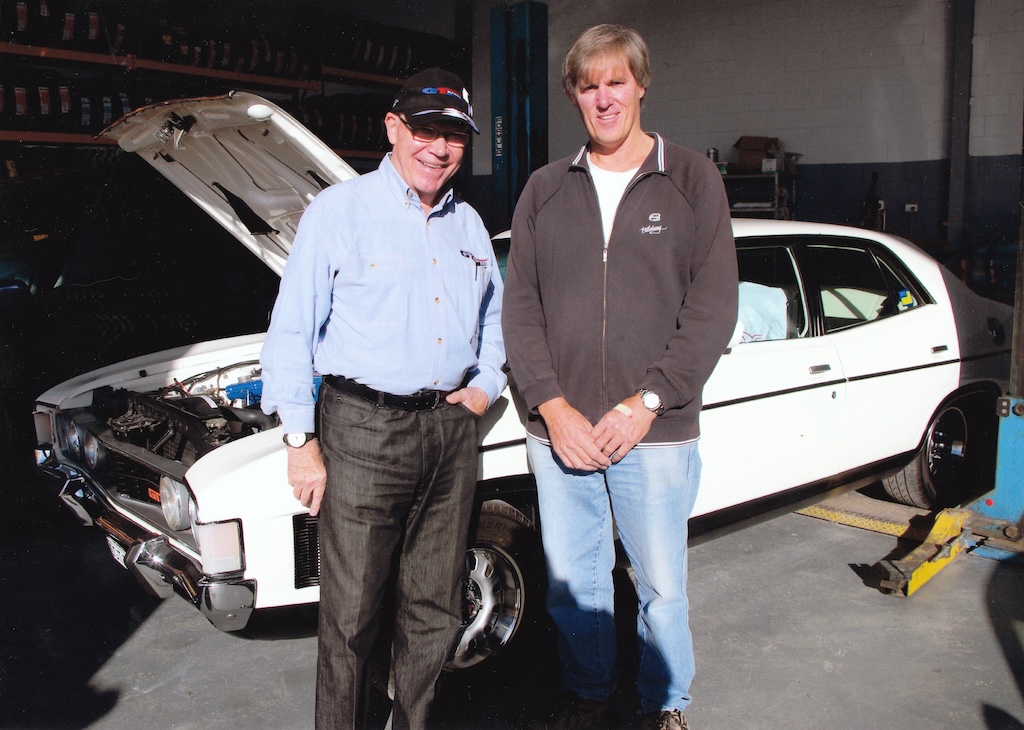 two men and a car