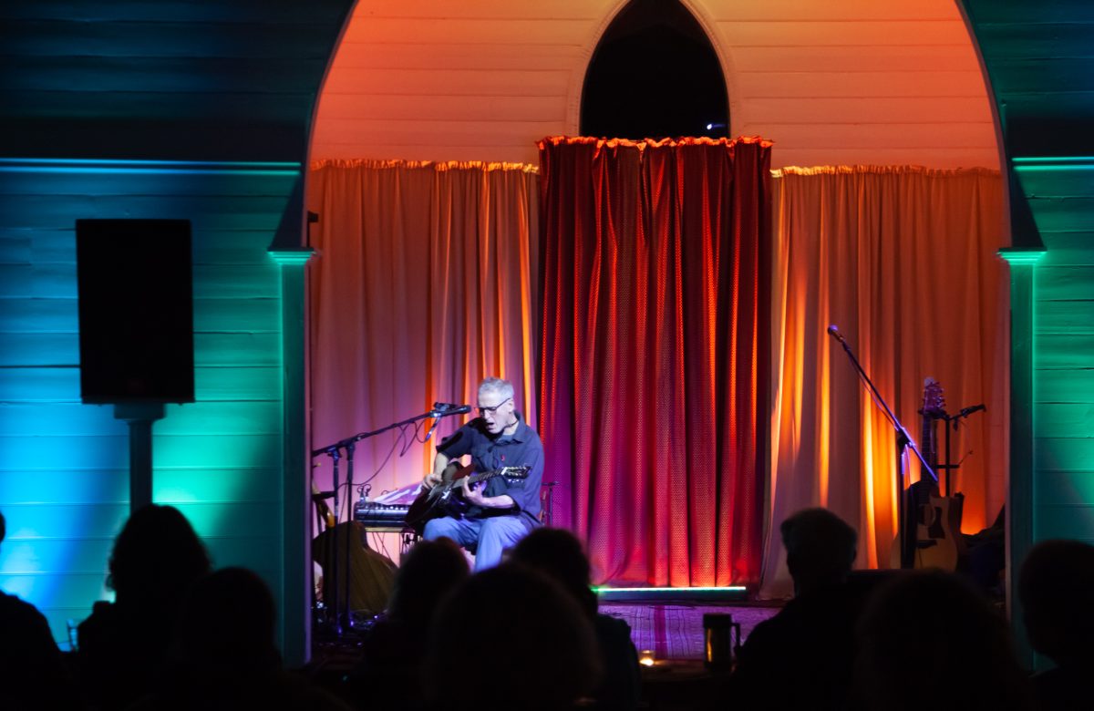 man singing on stage