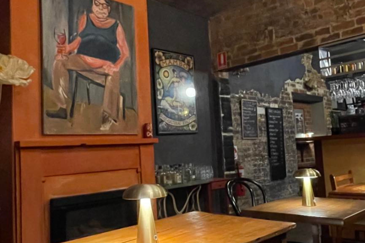Tables and painting in a wine bar.