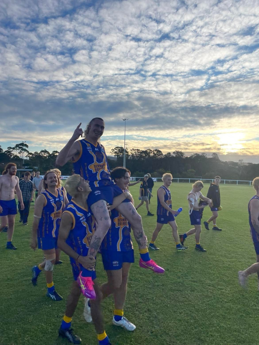 Sammy O'Connor is carried off the ground at Eden on 24 May after his 150th game for Bermagui Breakers. They are wearing their jerseys for the Indigenous round.