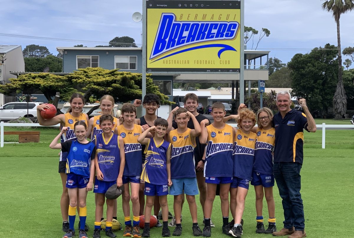 Some members of the Bermagui Breakers AFL Club with club president Phil Summerfield.