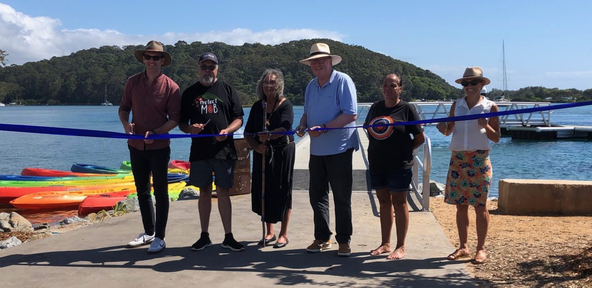 Eurobodalla Shire Mayor Mat Hatcher, Joonga Land and Water Aboriginal Corporation director Wally Stewart, Aunty Vivienne Mason of the Djaadjawan Dancers, Member for Bega Dr Michael Holland, Julie-Ann Mason, chair of Wagonga Local Aboriginal Land Council, and Tonia Clarkson of NSW Department of Primary Industries and Regional Development at the official opening of the Wagonga Inlet Living Shoreline in Narooma on 1 February.