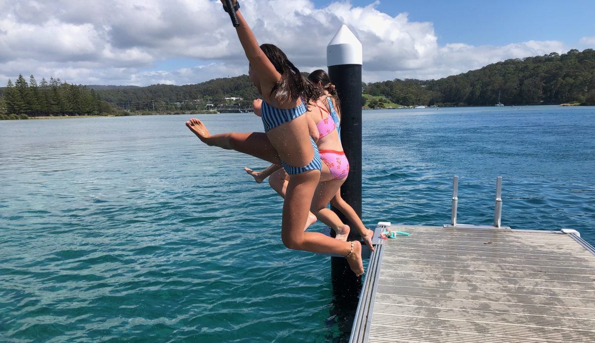 The first three to dive off the new jetty at the official opening of the Wagonga Inlet Living Shoreline in Narooma on 1 February.