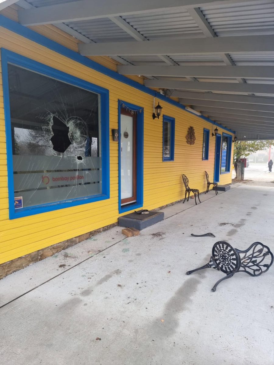 A smashed window at a restaurant