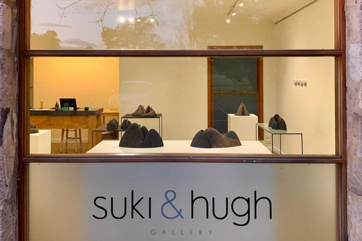 Looking through a window into an art gallery.
