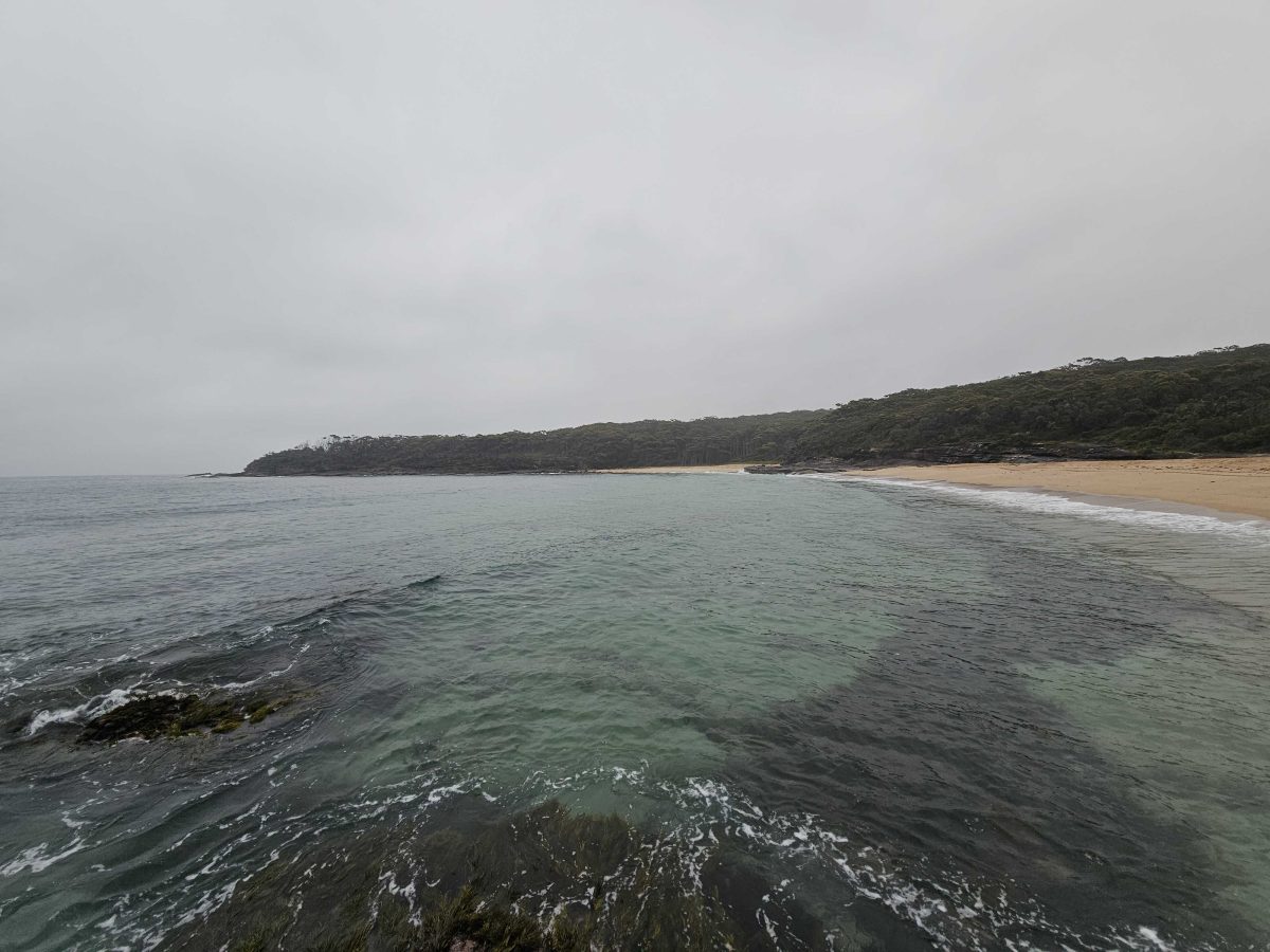 A beach with an overcast sky