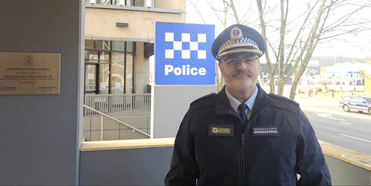 Monaro Police District Commander Superintendent Toby Lindsay in front of police sign