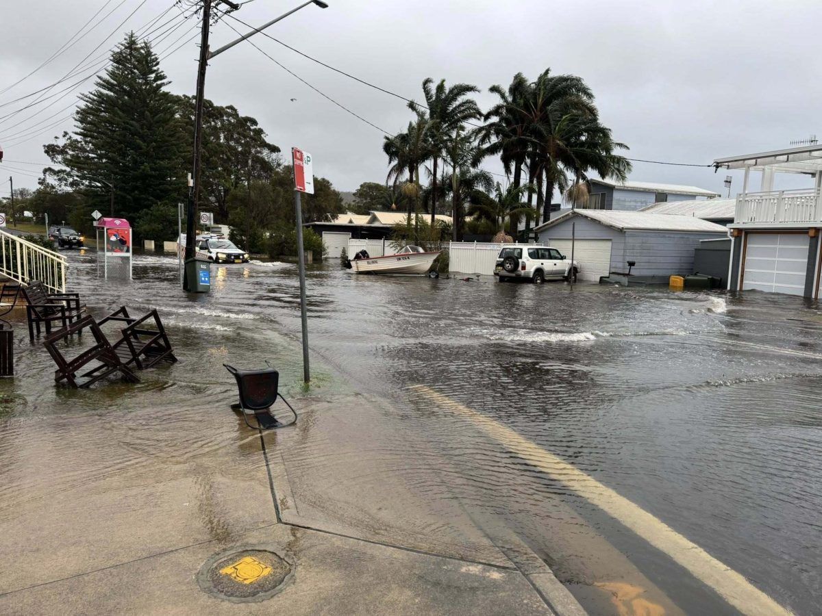 Water across a road at Burrill Lake